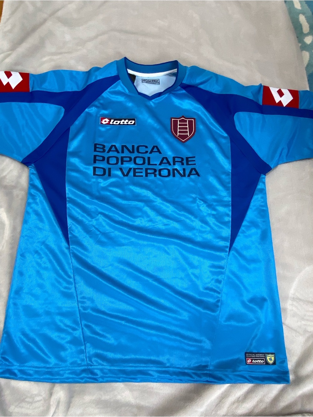 LOTTO Bright Blue Soccer Shirt with Dark Blue Panels and Red Accents